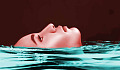 face of woman floating in water